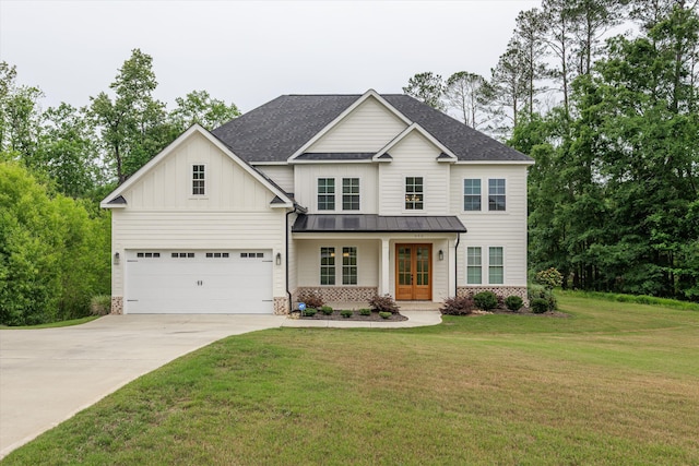 552 River Oaks Ln, Evans, GA 30809 - view of front of property with french doors, concrete driveway, a standing seam roof, a front yard, and roof with shingles