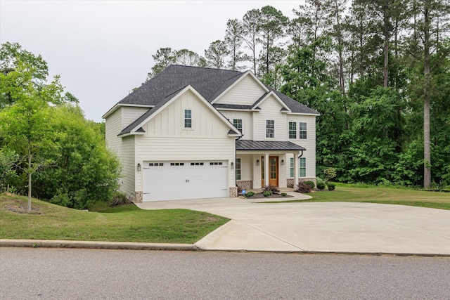 552 River Oaks Ln, Evans, GA 30809 - view of front facade with driveway, a front lawn, covered porch, board and batten siding, and a standing seam roof