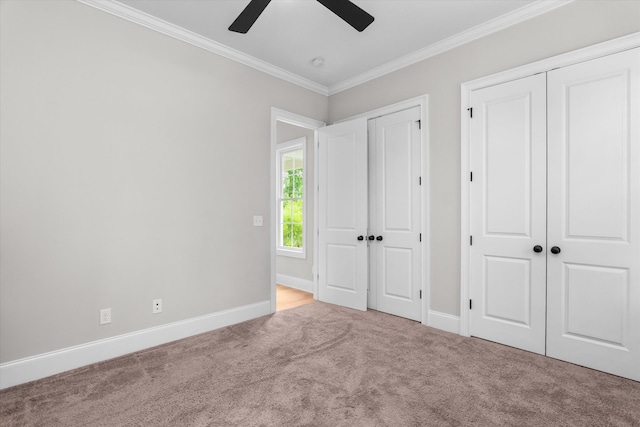 552 River Oaks Ln, Evans, GA 30809 - unfurnished bedroom with two closets, crown molding, carpet, baseboards, and a ceiling fan