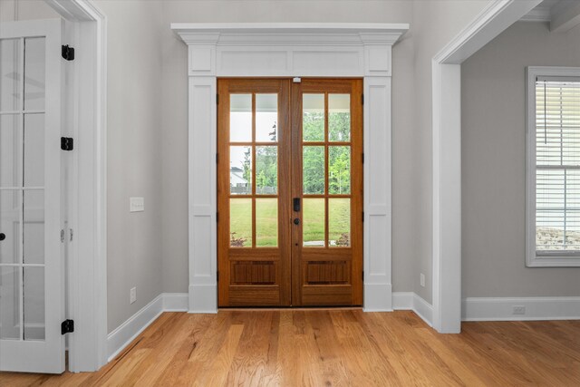 552 River Oaks Ln, Evans, GA 30809 - foyer featuring french doors, light wood-type flooring, baseboards, and healthy amount of natural light