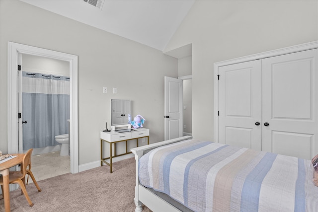 552 River Oaks Ln, Evans, GA 30809 - bedroom with light carpet, a closet, high vaulted ceiling, connected bathroom, and baseboards