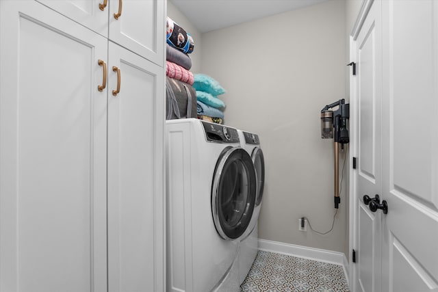 552 River Oaks Ln, Evans, GA 30809 - laundry room with washing machine and clothes dryer, cabinet space, and tile patterned floors
