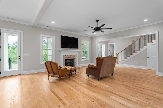 552 River Oaks Ln, Evans, GA 30809 - living area with light wood-style flooring, a fireplace, stairway, baseboards, and ceiling fan