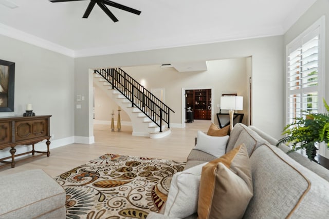 29 Savannah River Pl, North Augusta, SC 29841 - living area featuring crown molding, a ceiling fan, baseboards, light wood-type flooring, and stairway