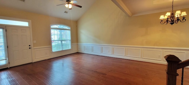 foyer featuring dark hardwood / wood-style flooring, ceiling fan with notable chandelier, vaulted ceiling, and ornamental molding