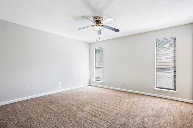 661 Kemper Dr, Evans, GA 30809 - empty room with ceiling fan, carpet, and plenty of natural light