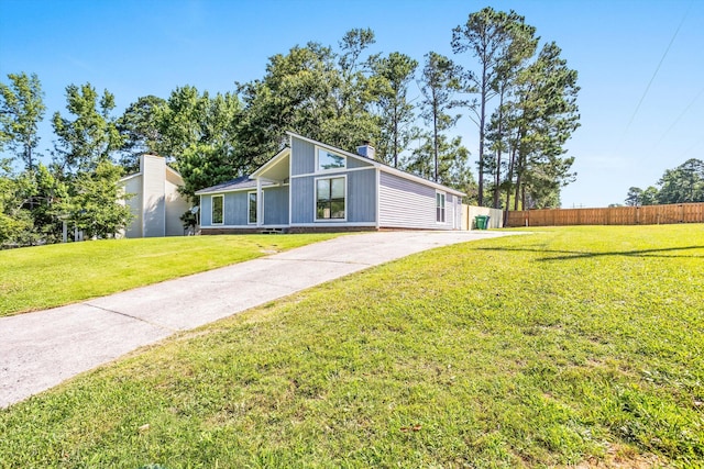 661 Kemper Dr, Evans, GA 30809 - view of front facade featuring a chimney and driveway