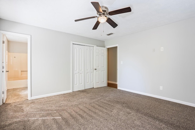 661 Kemper Dr, Evans, GA 30809 - unfurnished bedroom with carpet flooring, a closet, ensuite bath, and a ceiling fan