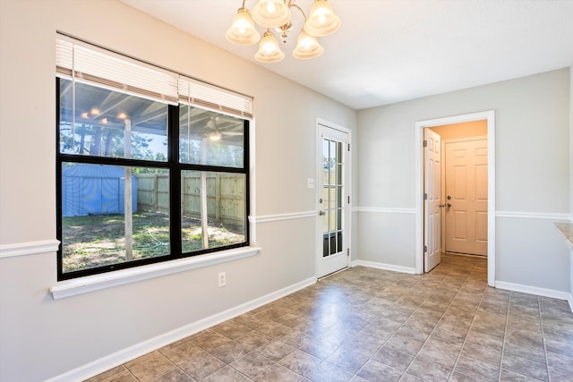 661 Kemper Dr, Evans, GA 30809 - spare room with a chandelier and baseboards