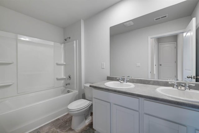 full bathroom with vanity, shower / bathtub combination, and toilet