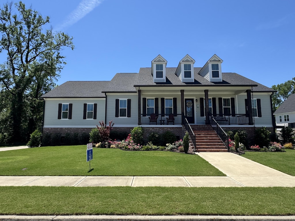 584 Rivernorth Dr, North Augusta, SC 29841 - cape cod house featuring covered porch and a front lawn
