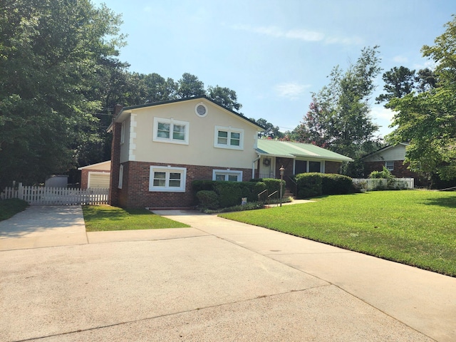 2023 Pisgah Rd, North Augusta, SC 29841 - tri-level home featuring brick siding, concrete driveway, a garage, and stucco siding