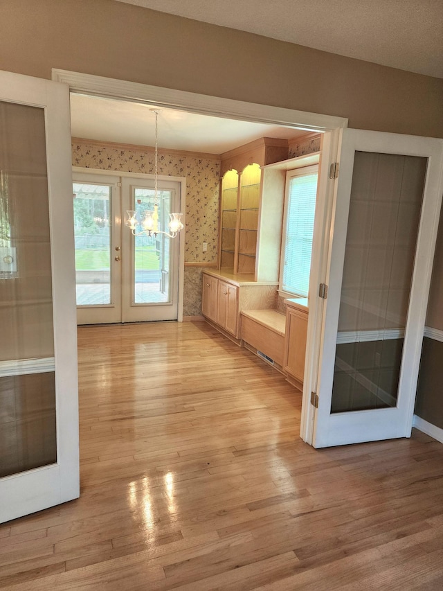 2023 Pisgah Rd, North Augusta, SC 29841 - unfurnished dining area featuring light wood-type flooring and a chandelier