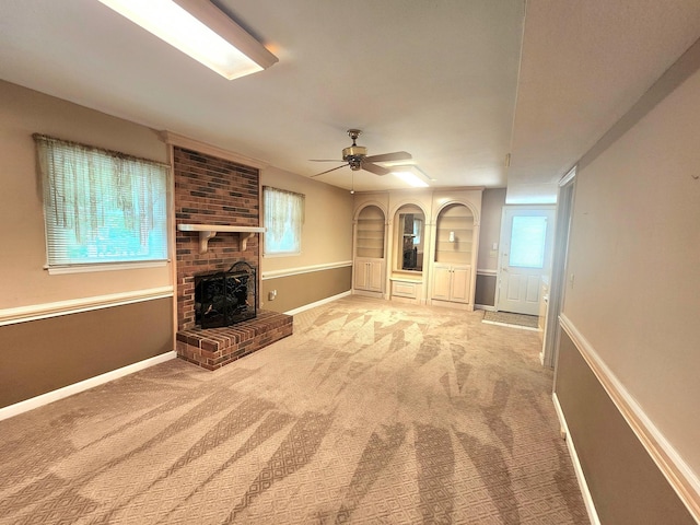 2023 Pisgah Rd, North Augusta, SC 29841 - unfurnished living room with carpet, ceiling fan, a brick fireplace, and built in features