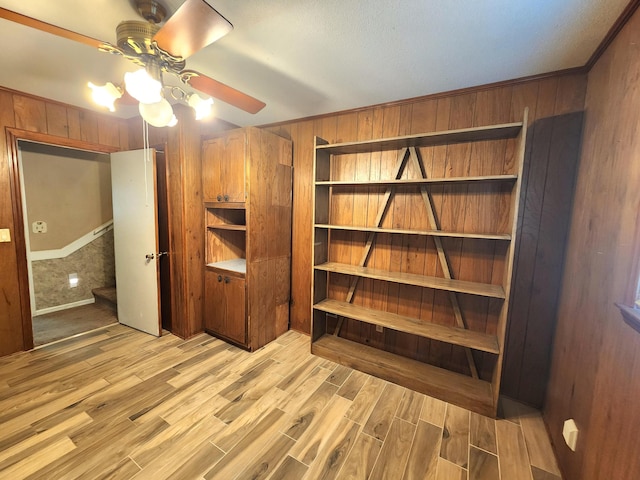 2023 Pisgah Rd, North Augusta, SC 29841 - unfurnished bedroom featuring wooden walls, light wood-style flooring, and a ceiling fan