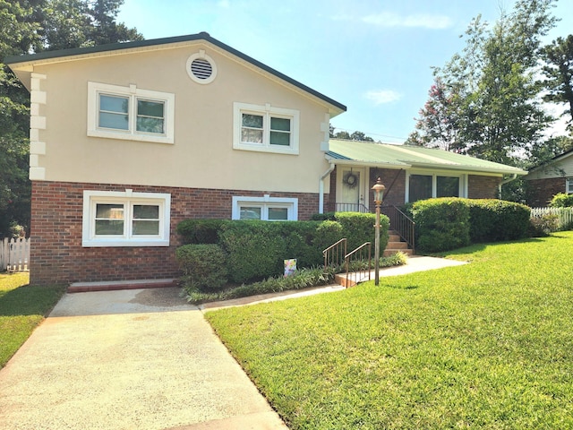 2023 Pisgah Rd, North Augusta, SC 29841 - split level home with brick siding, a front lawn, and stucco siding