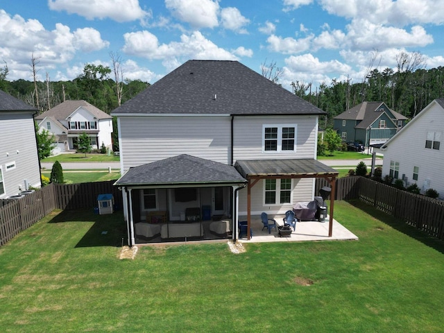 719 Nuttall St, Evans, GA 30809 - rear view of house featuring a sunroom, a patio, a fenced backyard, a shingled roof, and a residential view