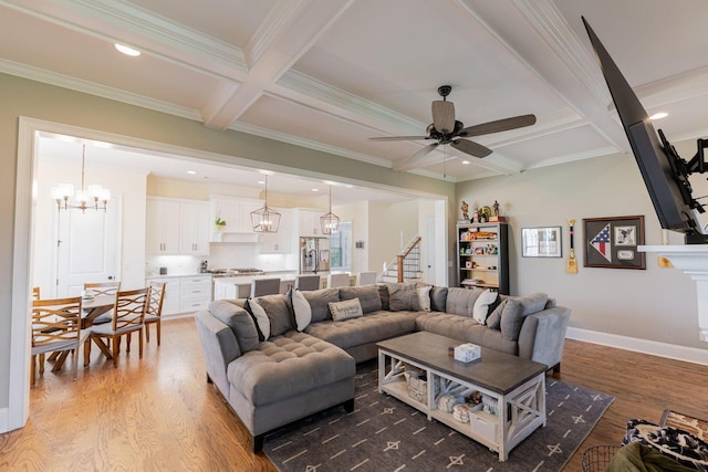 719 Nuttall St, Evans, GA 30809 - living room with coffered ceiling, ceiling fan, light wood-style flooring, ornamental molding, and a chandelier