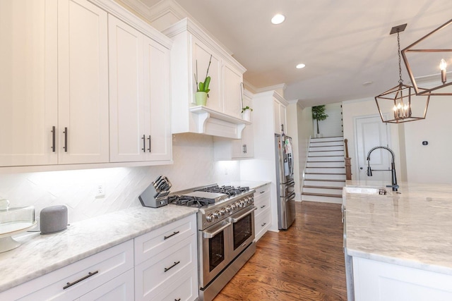719 Nuttall St, Evans, GA 30809 - kitchen featuring stainless steel appliances, white cabinetry, decorative backsplash, a chandelier, and recessed lighting