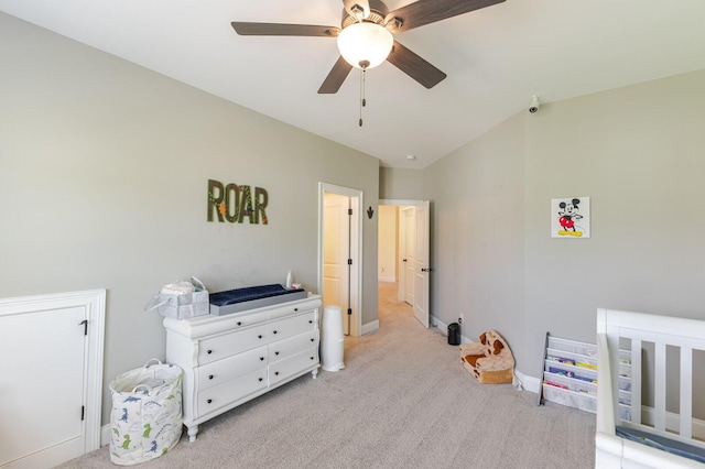 719 Nuttall St, Evans, GA 30809 - bedroom with light colored carpet, vaulted ceiling, a ceiling fan, and a crib