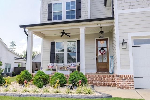 719 Nuttall St, Evans, GA 30809 - doorway to property with a garage, a porch, and a ceiling fan