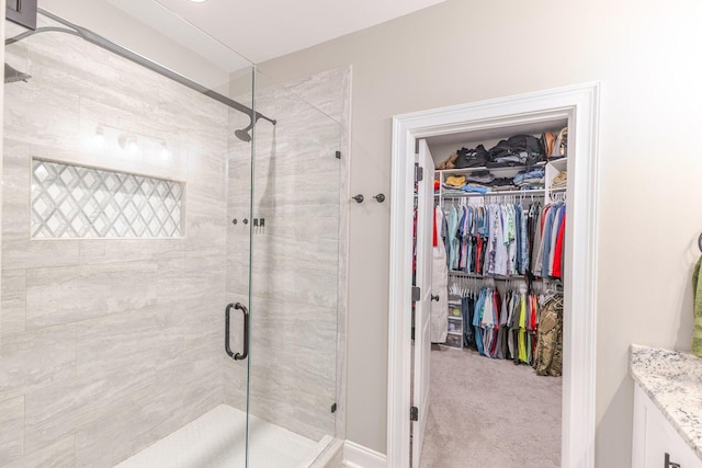 719 Nuttall St, Evans, GA 30809 - bathroom featuring a stall shower, vanity, and a spacious closet