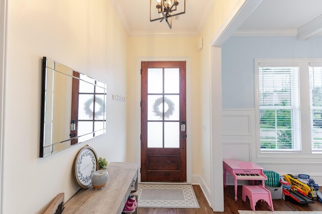 719 Nuttall St, Evans, GA 30809 - foyer entrance featuring a chandelier, wood finished floors, crown molding, and wainscoting