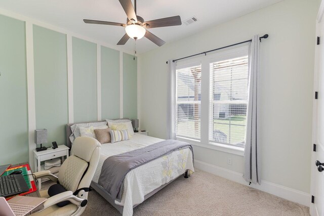 719 Nuttall St, Evans, GA 30809 - carpeted bedroom with multiple windows and ceiling fan