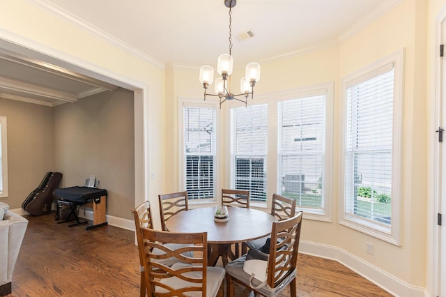 719 Nuttall St, Evans, GA 30809 - dining space with a chandelier, wood finished floors, and crown molding