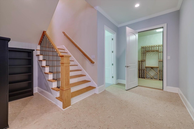 staircase featuring ornamental molding