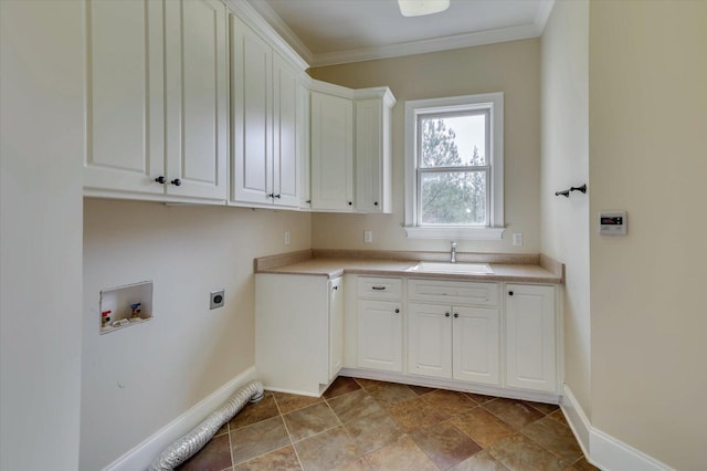 clothes washing area with cabinets, crown molding, sink, washer hookup, and hookup for an electric dryer