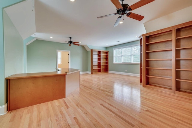 unfurnished living room featuring ceiling fan and light hardwood / wood-style flooring