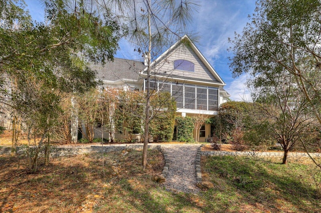 view of front facade with a sunroom