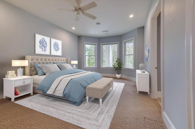 bedroom featuring light colored carpet and ceiling fan