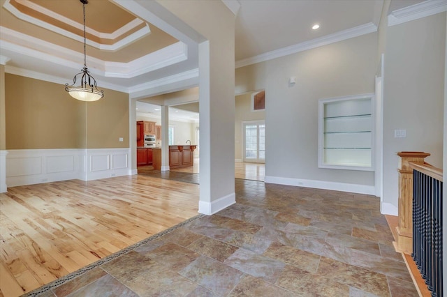 interior space featuring built in features and ornamental molding