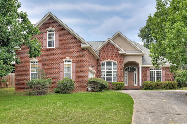215 Mineral Ct, Evans, GA 30809 - traditional-style house with brick siding, a shingled roof, and stucco siding