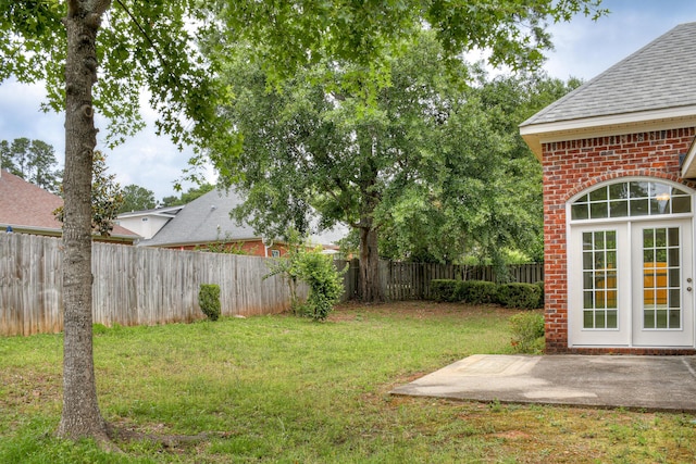 215 Mineral Ct, Evans, GA 30809 - fenced backyard featuring a patio area and french doors