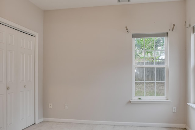215 Mineral Ct, Evans, GA 30809 - unfurnished bedroom with a closet and baseboards