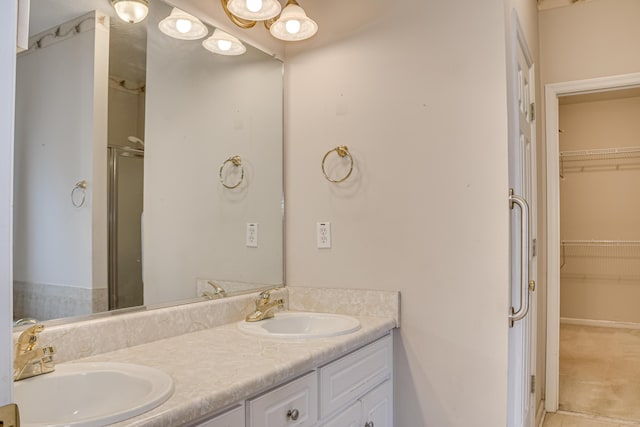 215 Mineral Ct, Evans, GA 30809 - bathroom featuring double vanity, a spacious closet, and a shower with shower door
