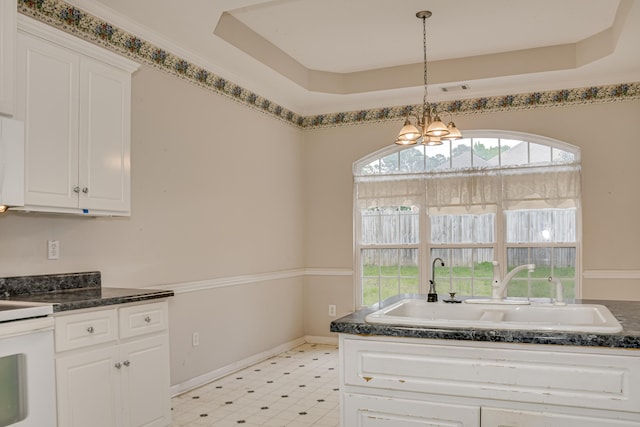 215 Mineral Ct, Evans, GA 30809 - kitchen with light floors, white cabinetry, a chandelier, and pendant lighting