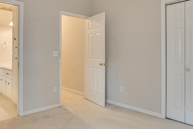 215 Mineral Ct, Evans, GA 30809 - unfurnished bedroom with light carpet, a closet, and ensuite bath