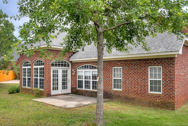 215 Mineral Ct, Evans, GA 30809 - rear view of property featuring a patio area, brick siding, and roof with shingles
