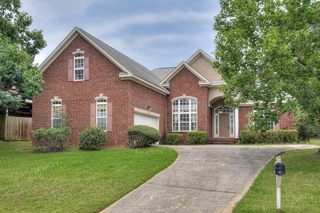215 Mineral Ct, Evans, GA 30809 - view of front of house featuring brick siding, driveway, and an attached garage