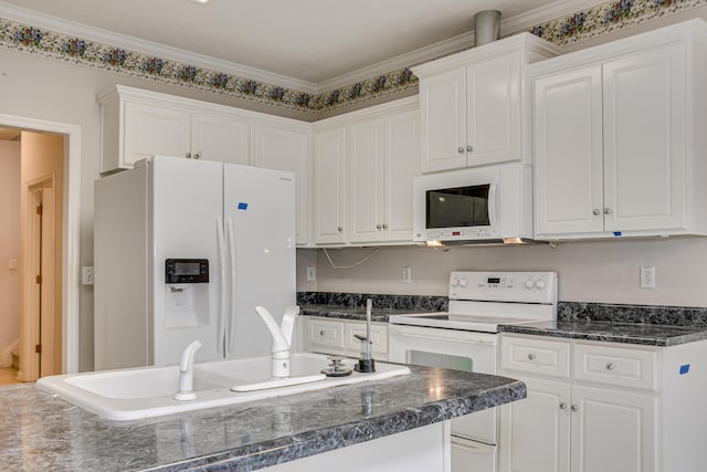 215 Mineral Ct, Evans, GA 30809 - kitchen with white appliances, dark countertops, white cabinetry, and ornamental molding