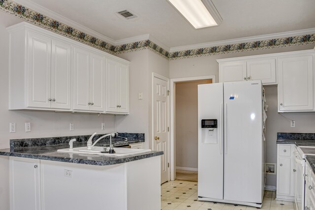 215 Mineral Ct, Evans, GA 30809 - kitchen featuring white refrigerator with ice dispenser, white cabinets, dark countertops, a peninsula, and crown molding