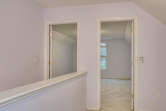 215 Mineral Ct, Evans, GA 30809 - hallway with vaulted ceiling and light carpet