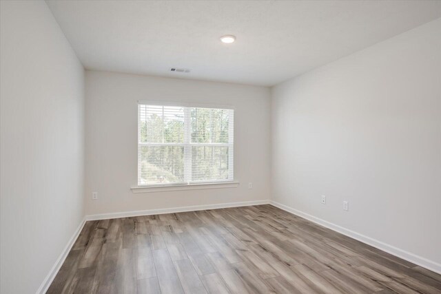 unfurnished room featuring light hardwood / wood-style flooring