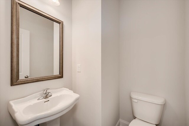 bathroom with toilet and sink