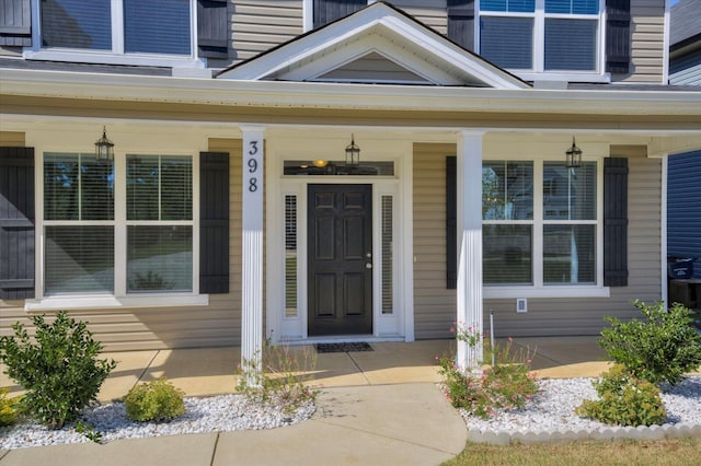 property entrance with covered porch