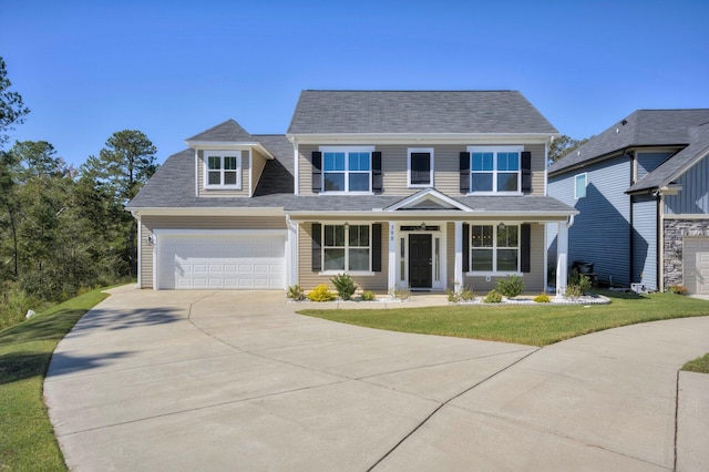 view of front of house featuring a front yard and a garage